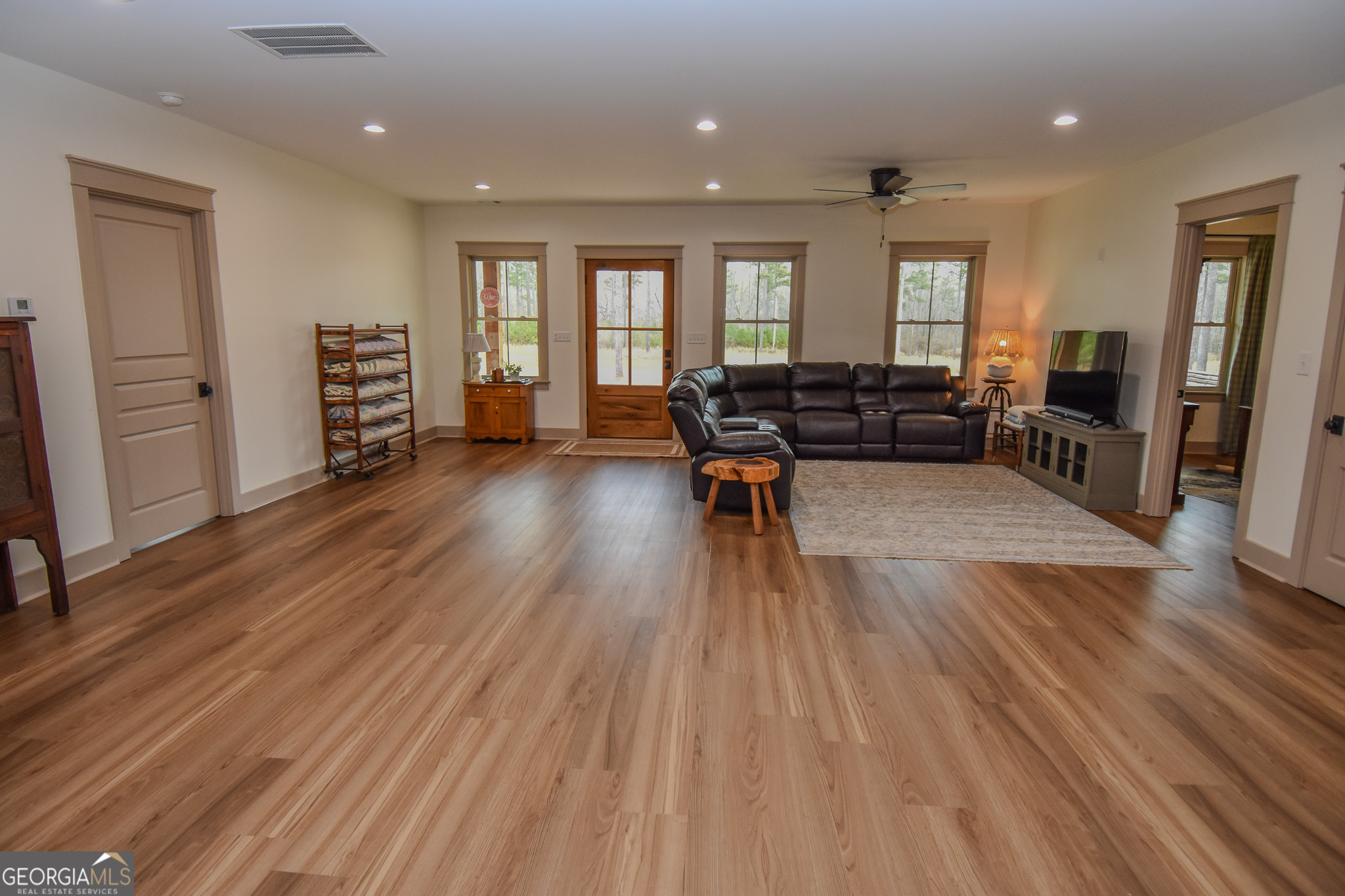 580-i B I B Howard Road Williamson, GA 30292 - Photo 9 of 123 a living room with furniture and wooden floor