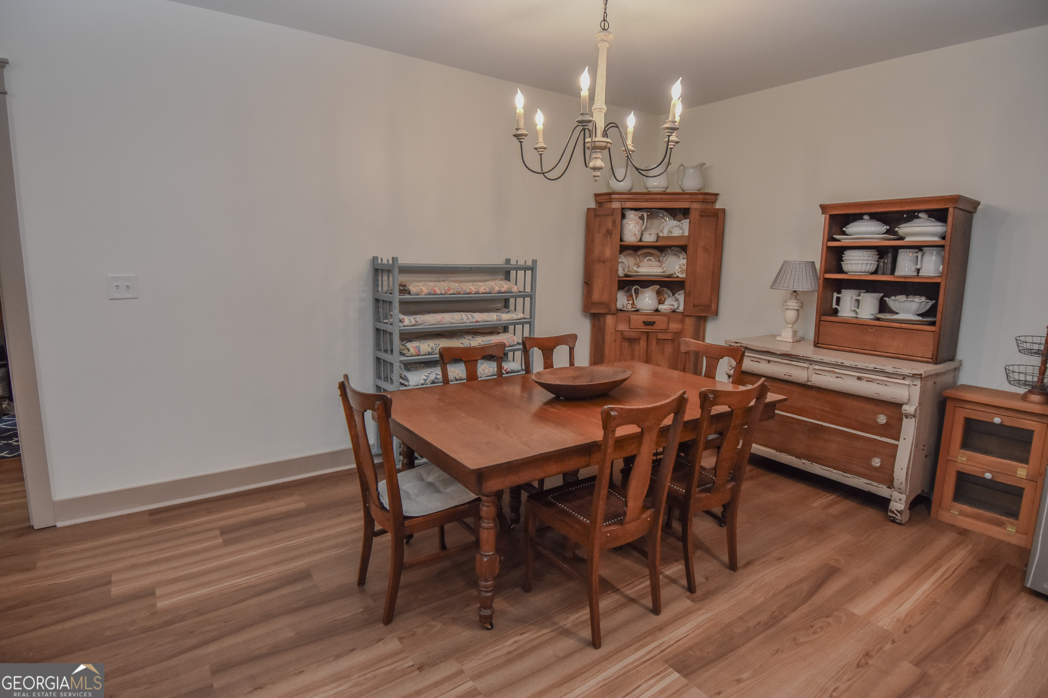580-i B I B Howard Road Williamson, GA 30292 - Photo 10 of 123 a view of a dining room with furniture wooden floor and chandelier