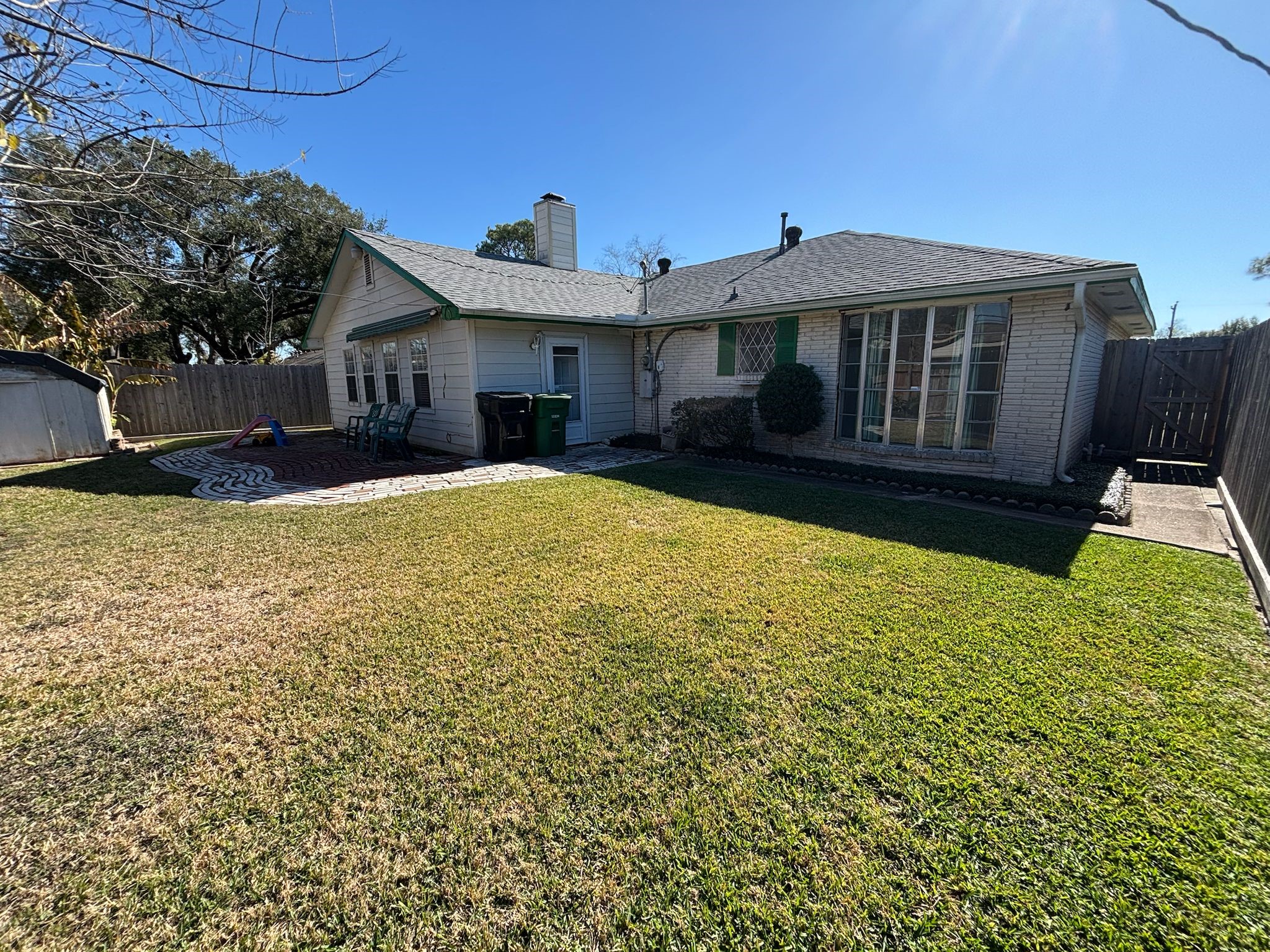 11018 Sharpview Drive Houston, TX 77072 - Photo 11 of 13 a view of a house with a yard