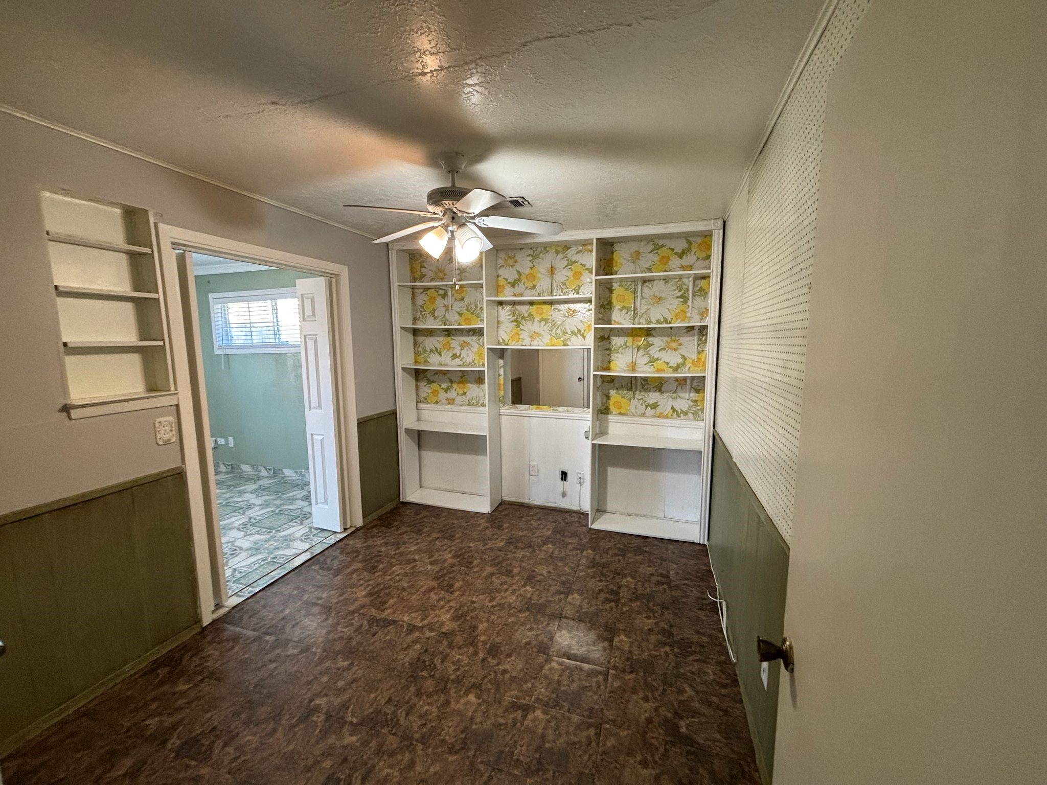 11018 Sharpview Drive Houston, TX 77072 - Photo 4 of 13 a view of walk in closet with empty racks