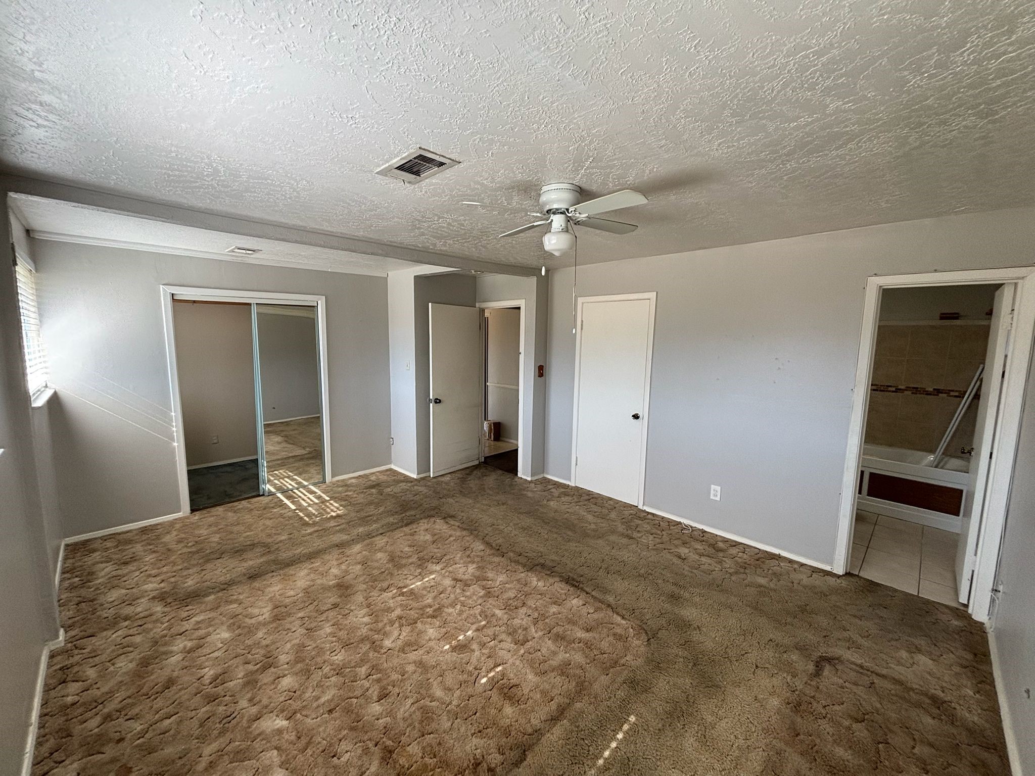 11018 Sharpview Drive Houston, TX 77072 - Photo 5 of 13 a view of an empty room with a window