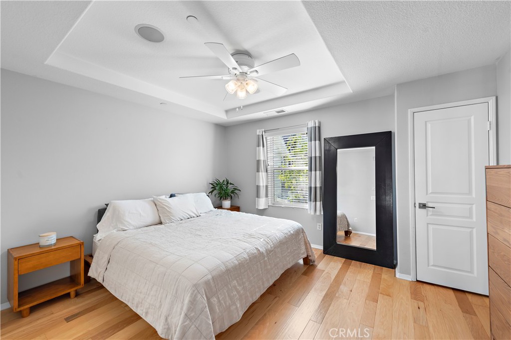 12 Triad Lane Ladera Ranch, CA 92694 - Photo 11 of 32 a bedroom with a bed and a chandelier