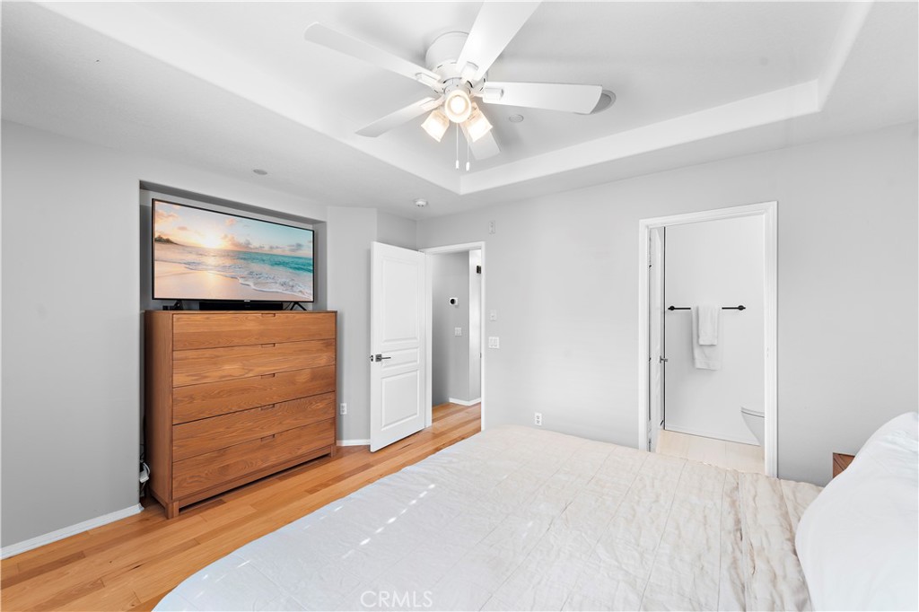 12 Triad Lane Ladera Ranch, CA 92694 - Photo 12 of 32 a view of a livingroom with a chandelier fan and windows