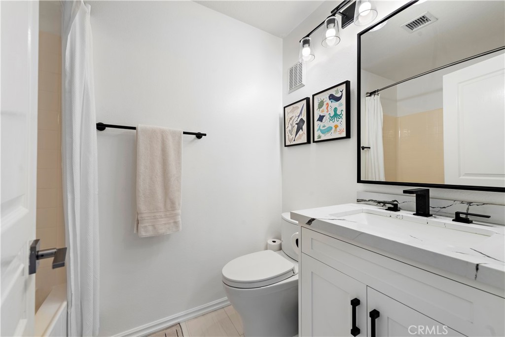 12 Triad Lane Ladera Ranch, CA 92694 - Photo 18 of 32 a bathroom with a sink vanity and toilet
