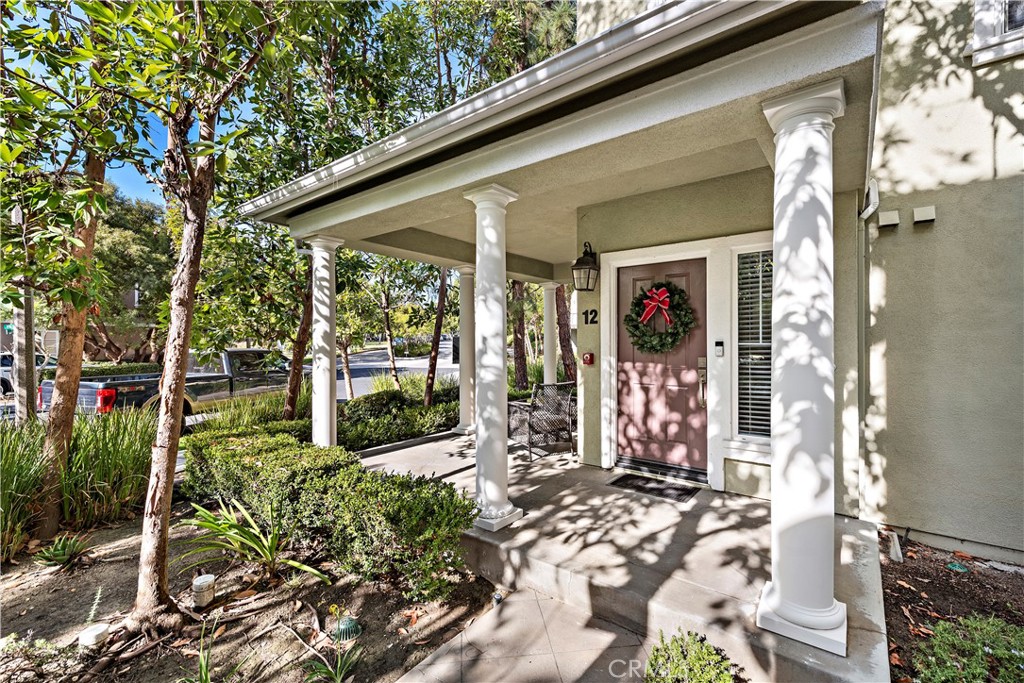 12 Triad Lane Ladera Ranch, CA 92694 - Photo 24 of 32 a view of a patio with table and chairs and potted plants