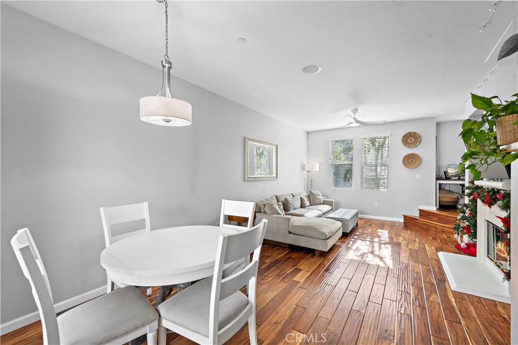 12 Triad Lane Ladera Ranch, CA 92694 - Photo 9 of 32 a view of a dining room with furniture window and wooden floor