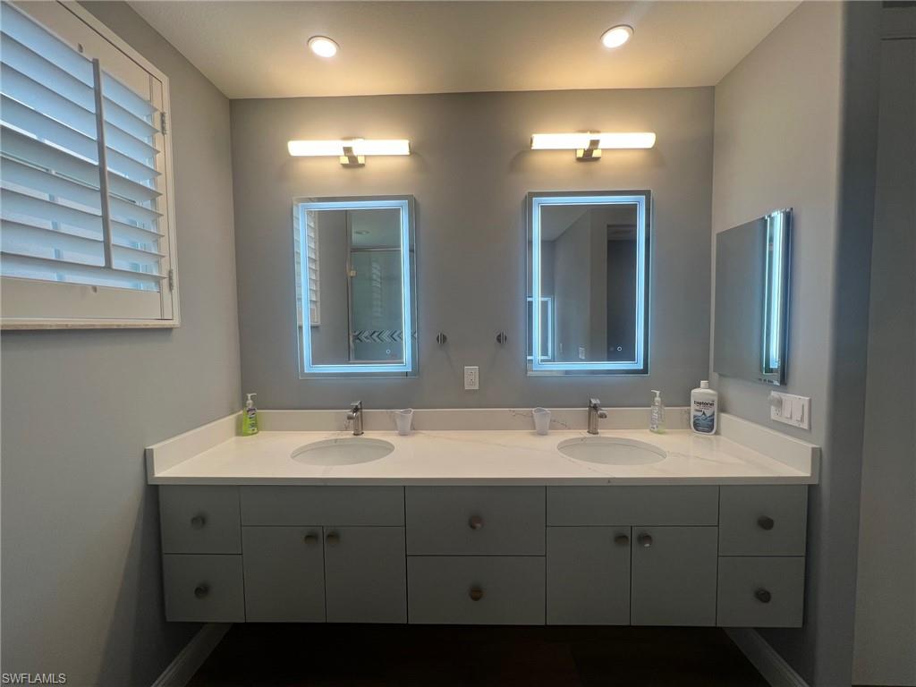 817 Regency Reserve Circle, Unit 3901 Naples, FL 34119 - Photo 16 of 35 Bathroom with double vanity
