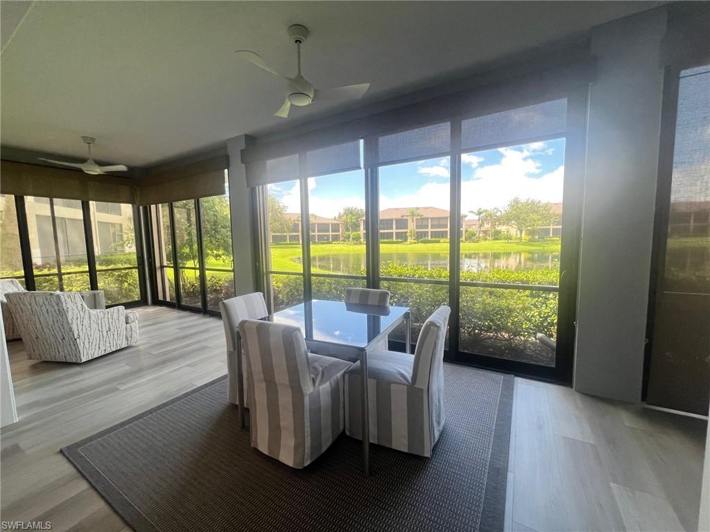 817 Regency Reserve Circle, Unit 3901 Naples, FL 34119 - Photo 21 of 35 Sunroom with ceiling fan and a water view