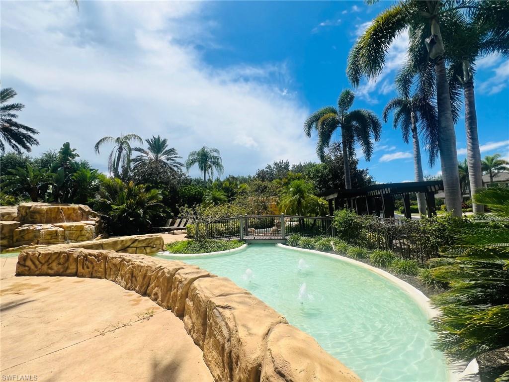 817 Regency Reserve Circle, Unit 3901 Naples, FL 34119 - Photo 34 of 35 View of pool featuring pool water feature