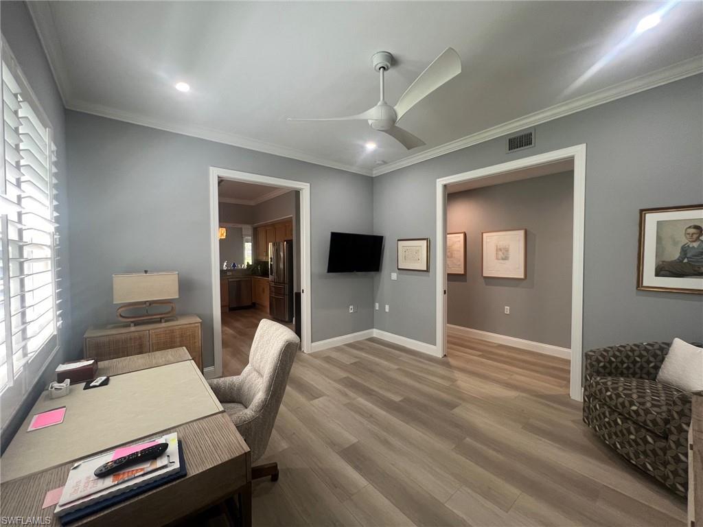 817 Regency Reserve Circle, Unit 3901 Naples, FL 34119 - Photo 10 of 35 Home office featuring hardwood / wood-style floors, ornamental molding, and ceiling fan