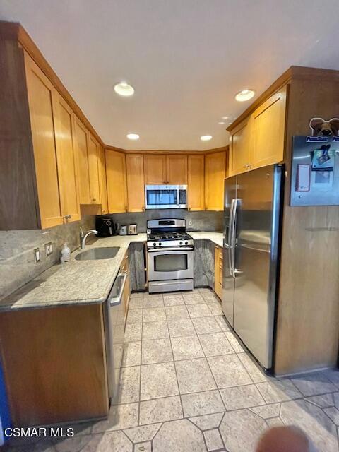 832 Katherine Road Simi Valley, CA 93063 - Photo 11 of 34 a kitchen with stainless steel appliances granite countertop a sink stove and refrigerator