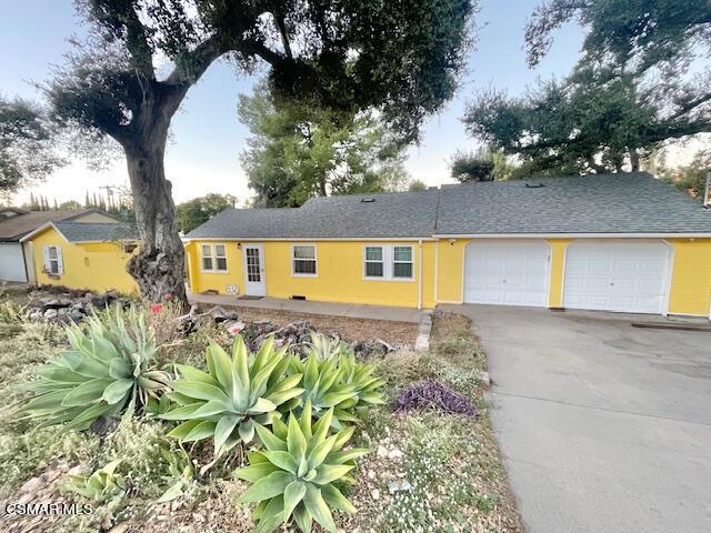 832 Katherine Road Simi Valley, CA 93063 - Photo 2 of 34 a front view of a house with a yard and a garden