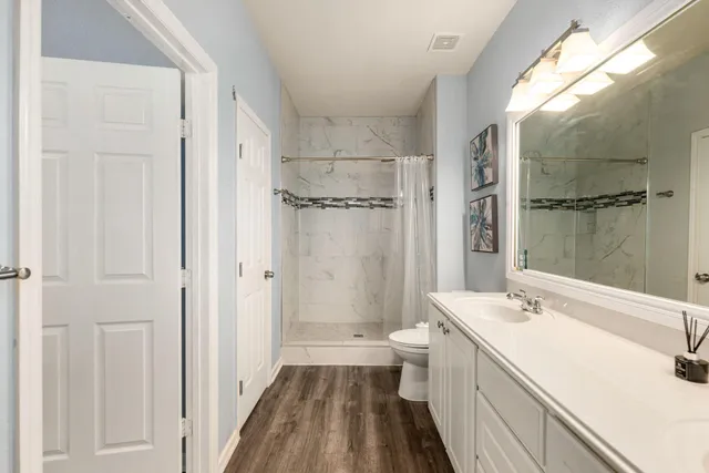 a living room with a bed furniture and a window