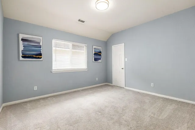 a view of a house with a small yard