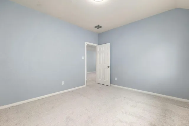 a view of house with backyard and porch