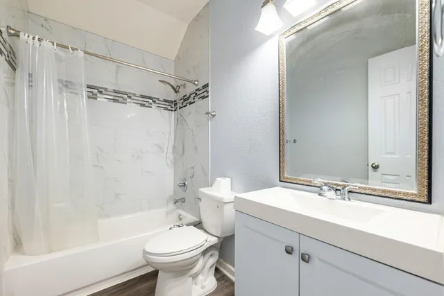 a view of a house with a backyard