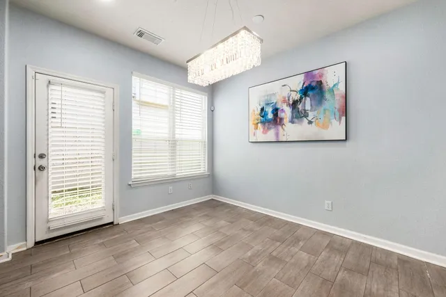 a living room with furniture and stairs