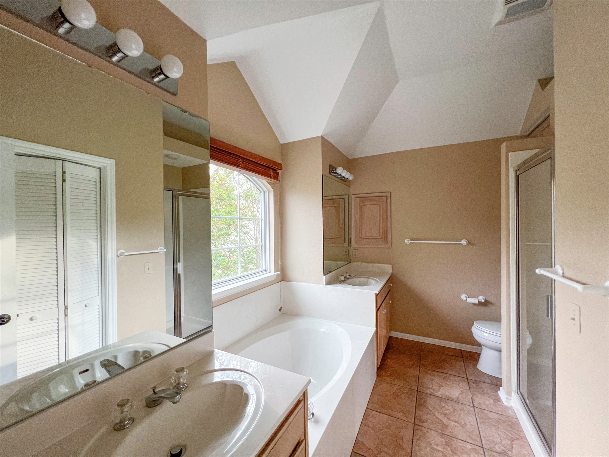 12010 Shady Springs Road Austin, TX 78758 - Photo 14 of 28 Primary Bathroom Upstairs with separate Framed Glass Door Shower and Tub