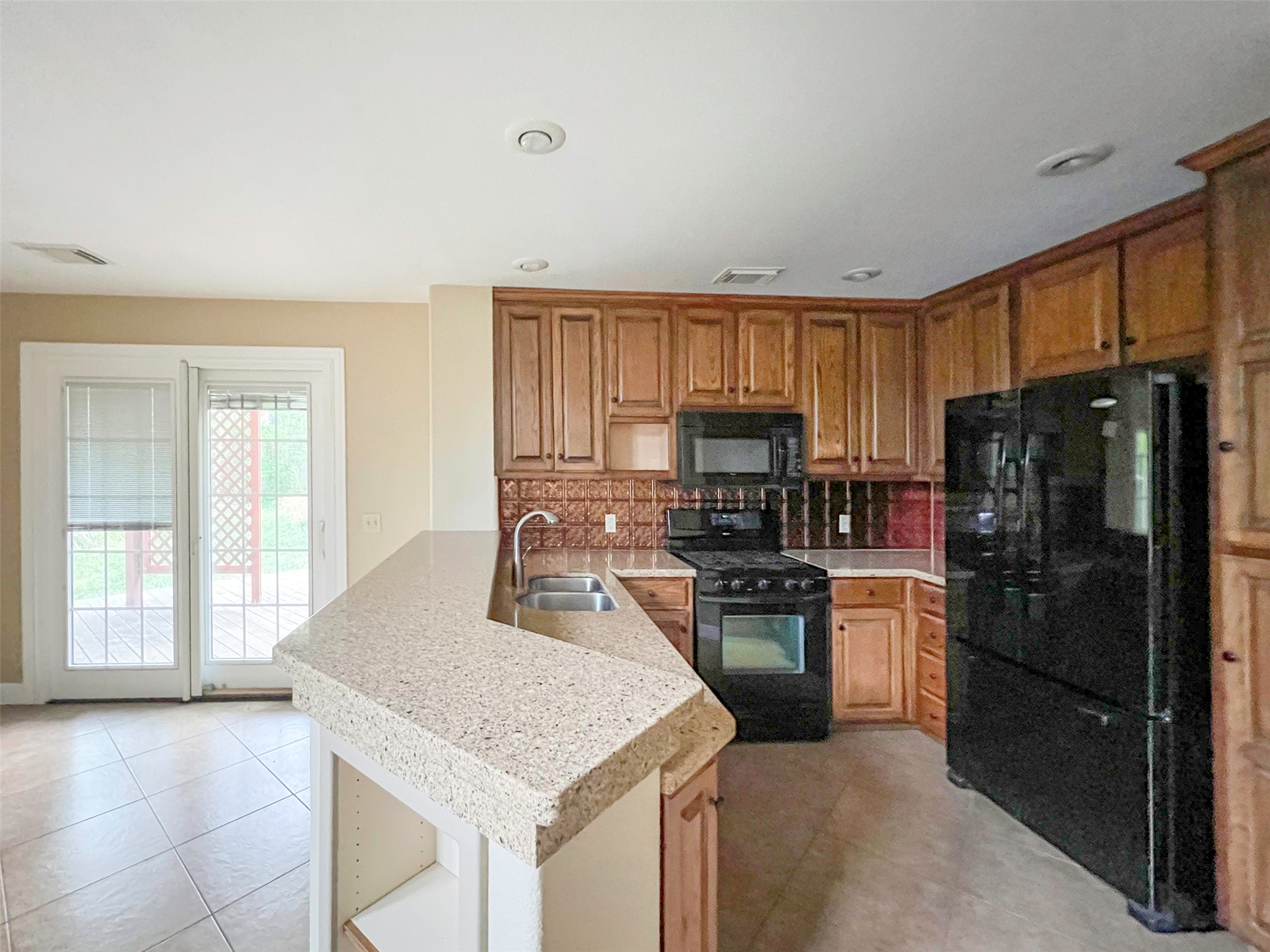 12010 Shady Springs Road Austin, TX 78758 - Photo 5 of 28 Kitchen (Refrigerator, is there for tenant use but not maintained by the landlord.)