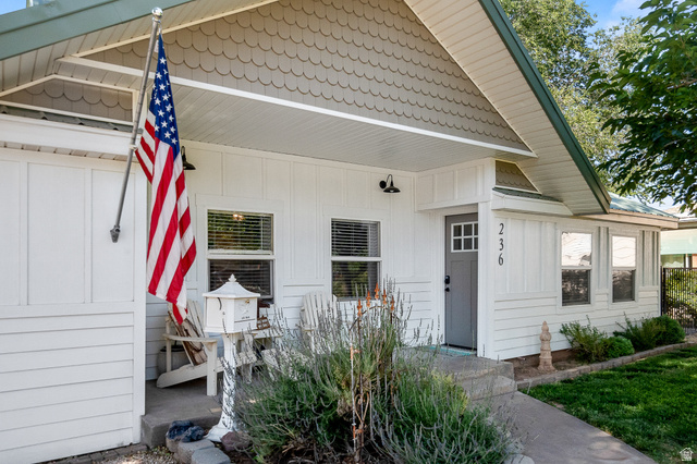 236 West 300 South Hurricane, UT 84737 - Photo 2 of 76 Charming front exterior featuring white horizontal siding and decorative scallop shingles