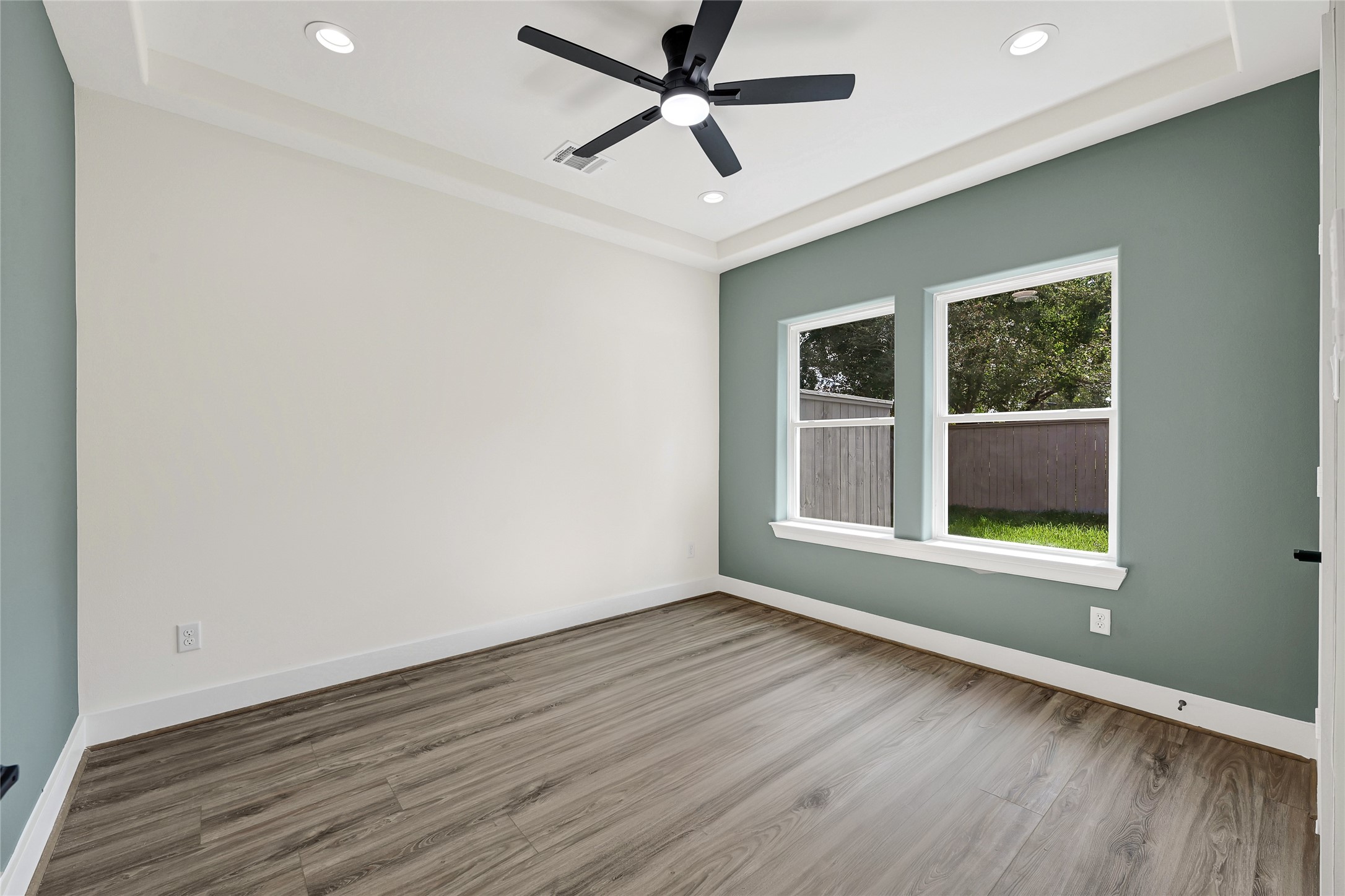 3834 Mt Pleasant Street Houston, TX 77021 - Photo 40 of 50 a view of an empty room with wooden floor and a window