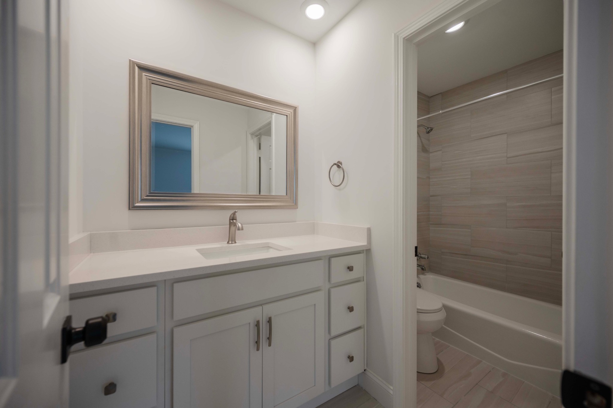 973 General George Patton Road Nashville, TN 37221 - Photo 12 of 15 a bathroom with a bathtub sink vanity and mirror