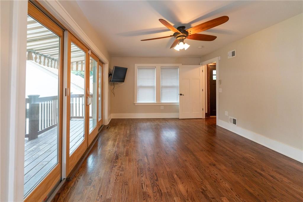262 Cliffview Road Pittsburgh, PA 15212 - Photo 10 of 14 First floor master bedroom with deck overlooking the back yard