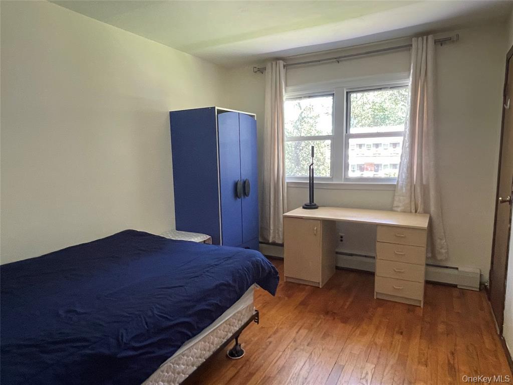 4 Cornwallis Road East Setauket, NY 11733 - Photo 10 of 16 a bedroom with a bed and a desk