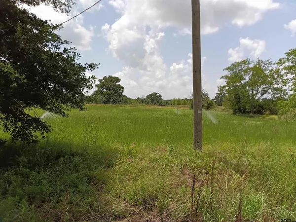 a view of a lake with a big yard