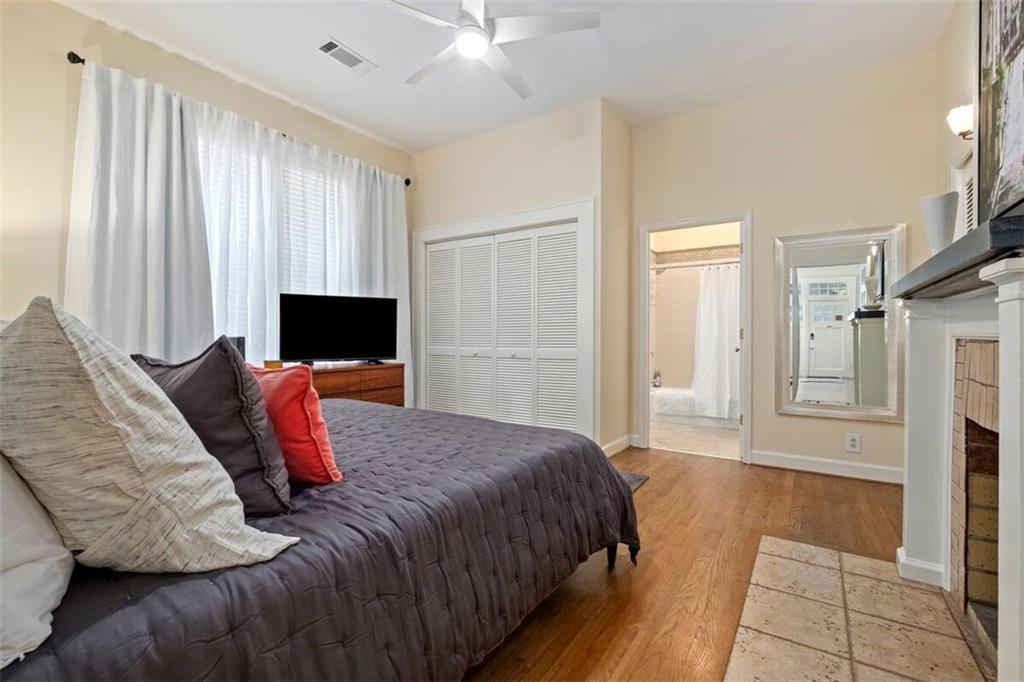 356 5th Street Northeast Atlanta, GA 30308 - Photo 16 of 54 a bedroom with a bed and a television