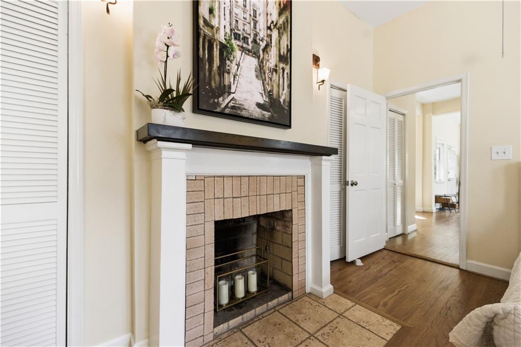 356 5th Street Northeast Atlanta, GA 30308 - Photo 17 of 54 a living room with furniture and a fireplace