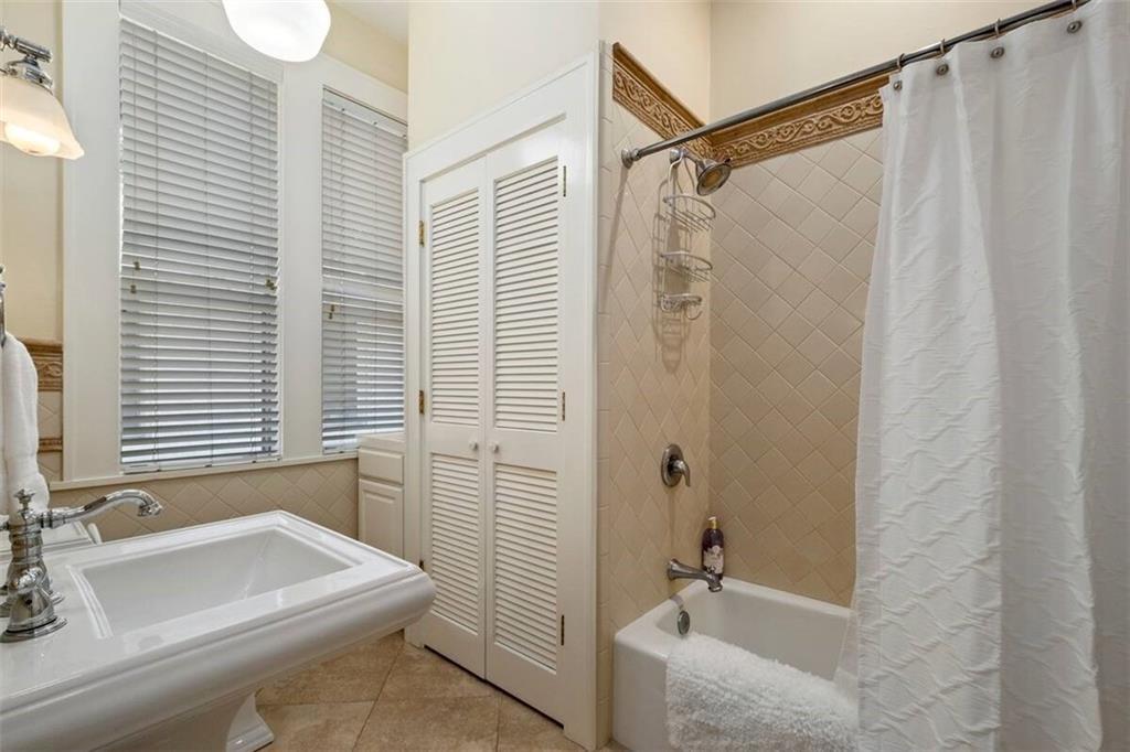 356 5th Street Northeast Atlanta, GA 30308 - Photo 19 of 54 a bathroom with a sink a toilet and shower