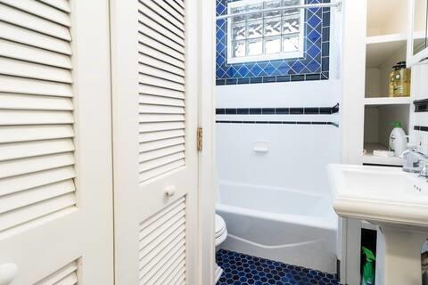 356 5th Street Northeast Atlanta, GA 30308 - Photo 31 of 54 a bathroom with a bathtub and a shower