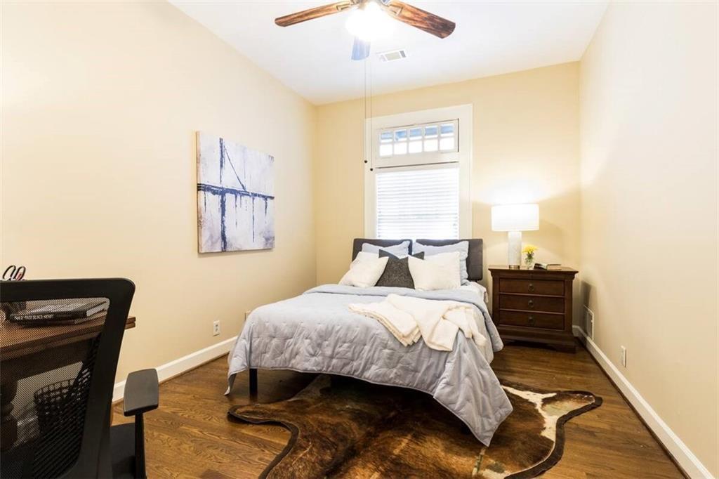 356 5th Street Northeast Atlanta, GA 30308 - Photo 32 of 54 a bedroom with a bed and a window