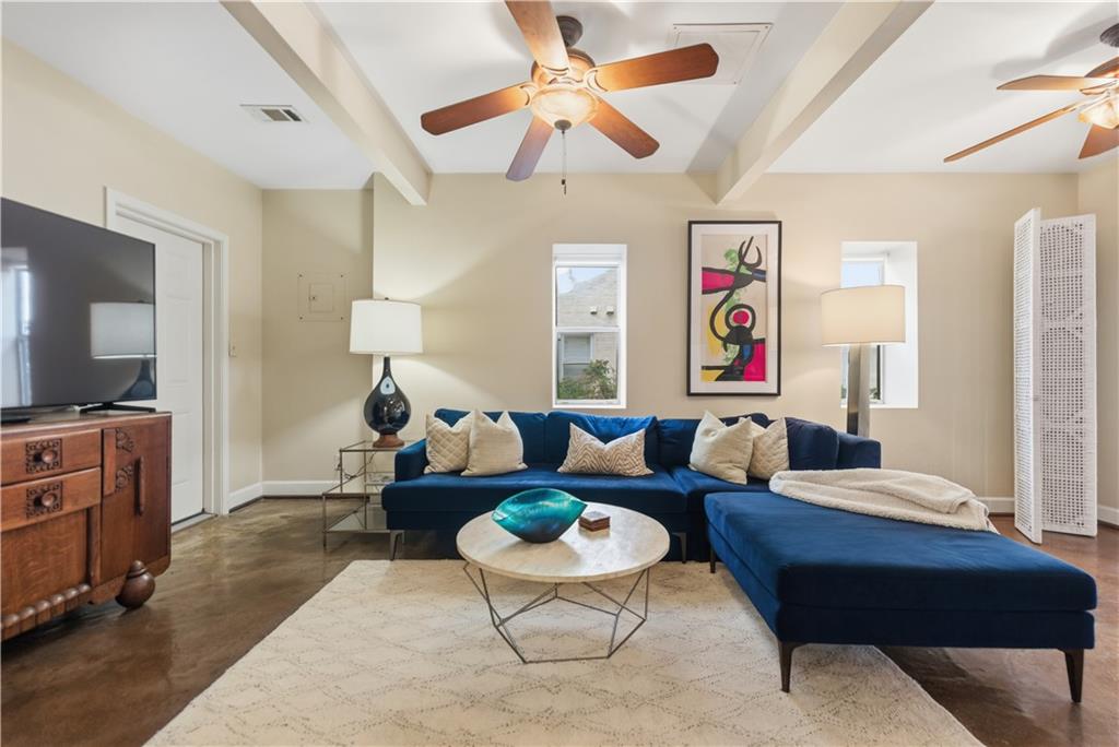 356 5th Street Northeast Atlanta, GA 30308 - Photo 40 of 54 a living room with furniture a ceiling fan and a rug