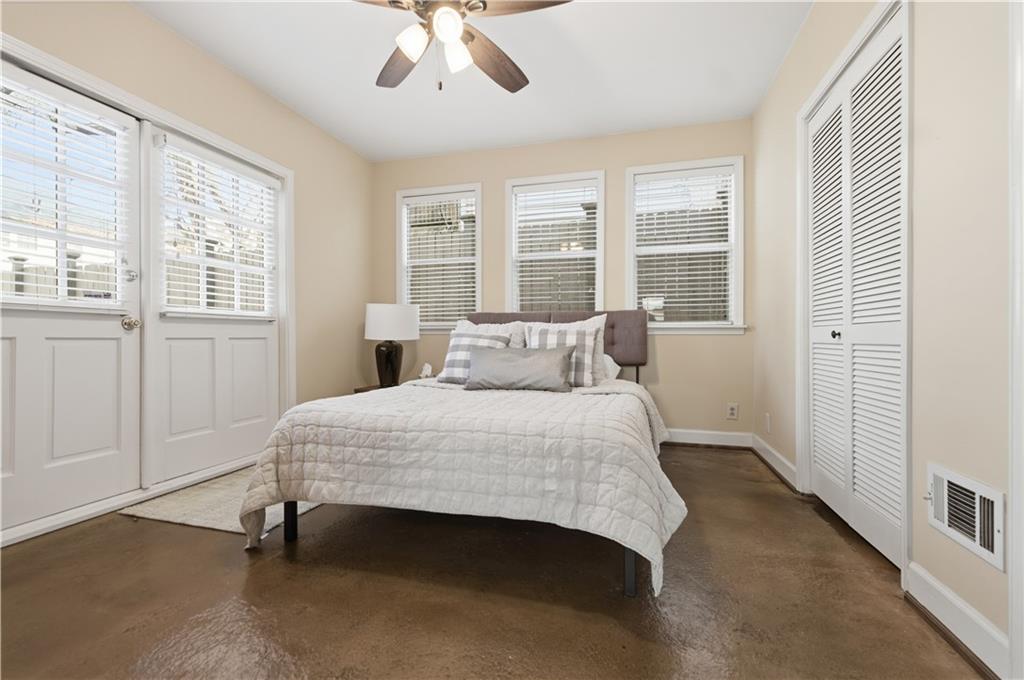 356 5th Street Northeast Atlanta, GA 30308 - Photo 44 of 54 a bedroom with a bed and a window