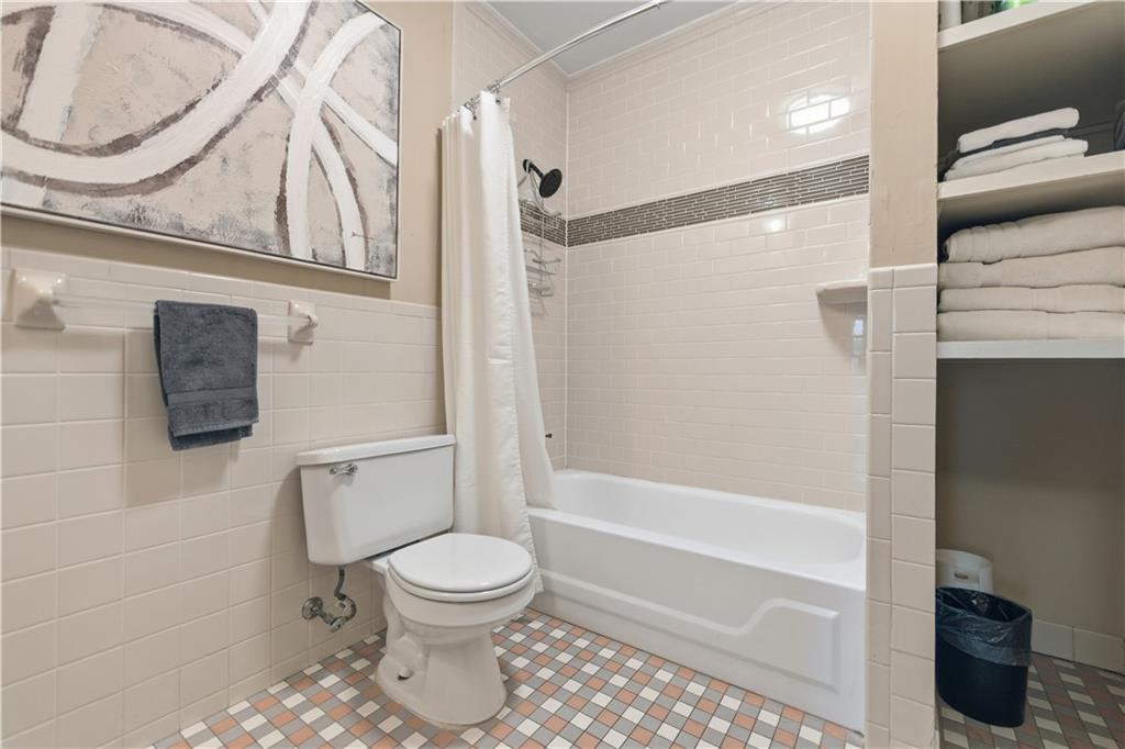 356 5th Street Northeast Atlanta, GA 30308 - Photo 48 of 54 a bathroom with a toilet and a shower