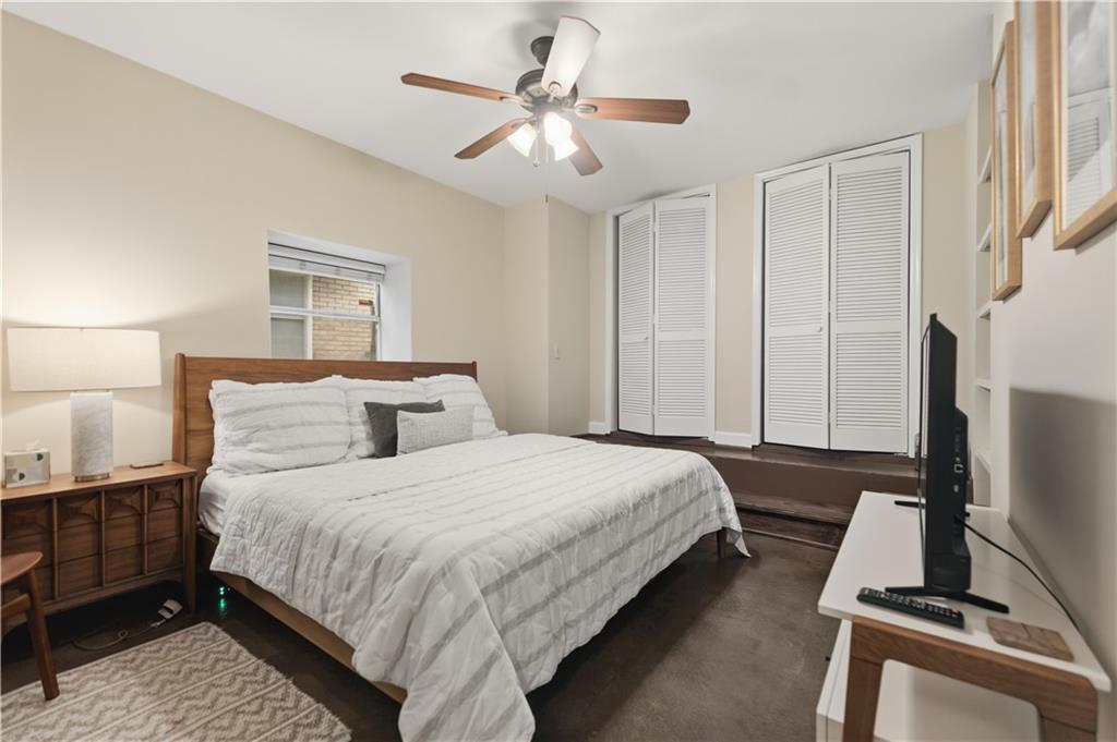 356 5th Street Northeast Atlanta, GA 30308 - Photo 49 of 54 a bedroom with a bed and a flat tv screen