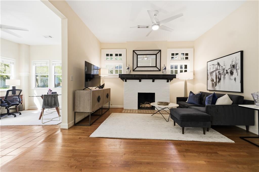 356 5th Street Northeast Atlanta, GA 30308 - Photo 7 of 54 a living room with furniture a fireplace and a flat screen tv