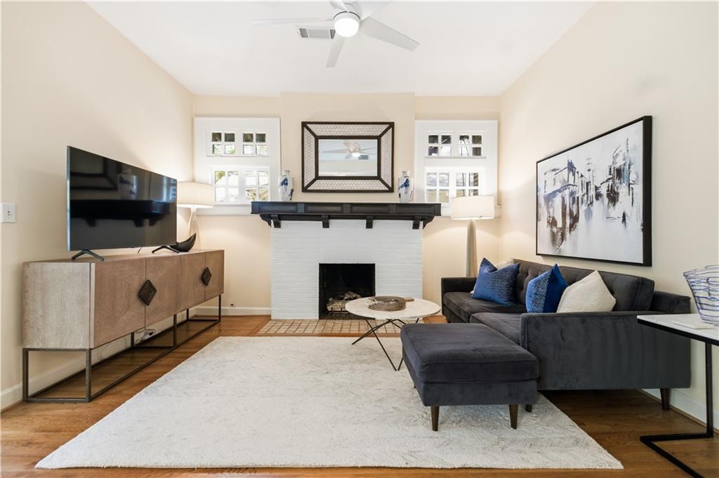 356 5th Street Northeast Atlanta, GA 30308 - Photo 8 of 54 a living room with furniture a flat screen tv and a fireplace