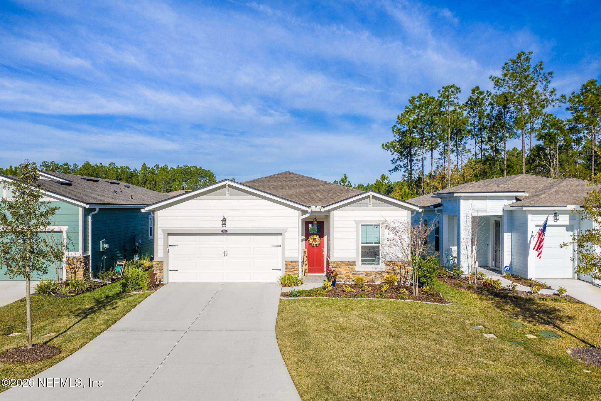 33 Pigeon Cove St. Johns, FL 32259 - Photo 1 of 37 a front view of a house with a yard and garage