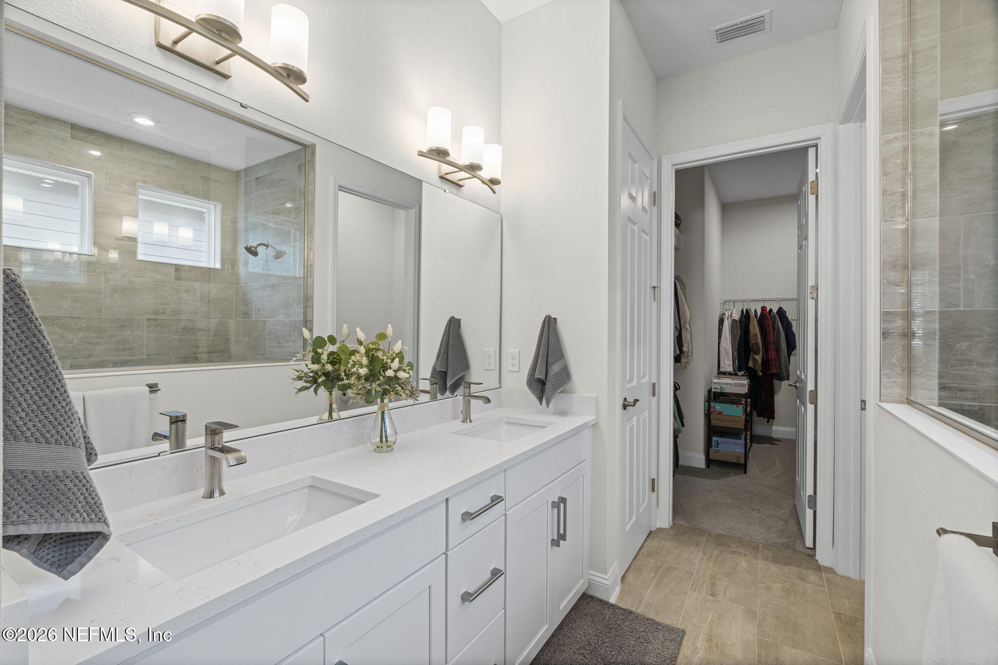 33 Pigeon Cove St. Johns, FL 32259 - Photo 11 of 37 a bathroom with double vanity sinks and a mirror