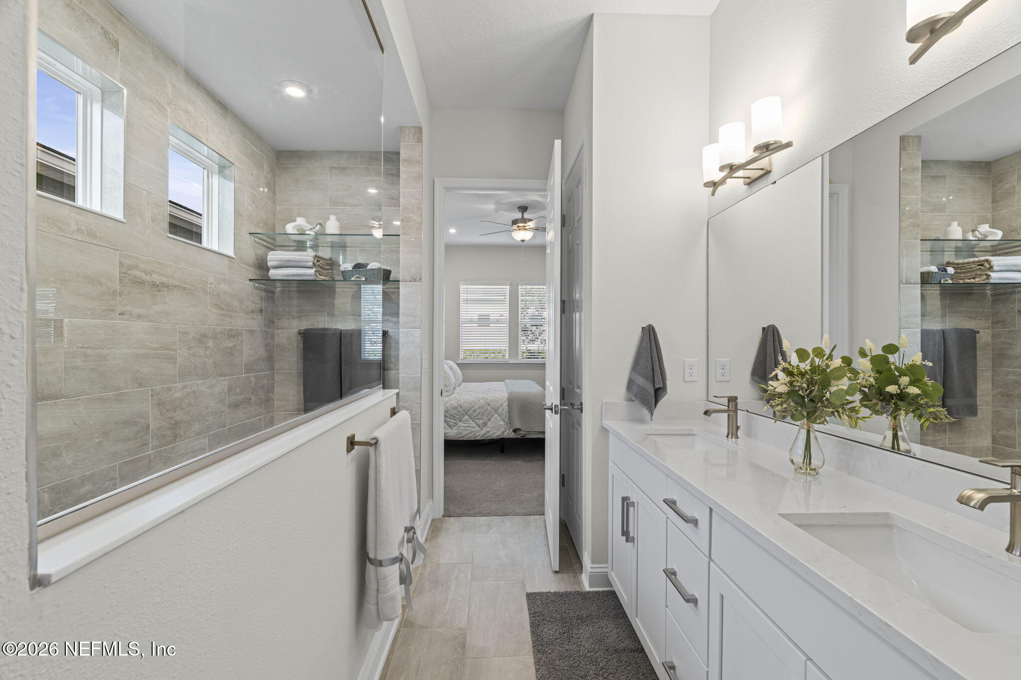 33 Pigeon Cove St. Johns, FL 32259 - Photo 12 of 37 a bathroom with a double vanity sink a toilet and shower