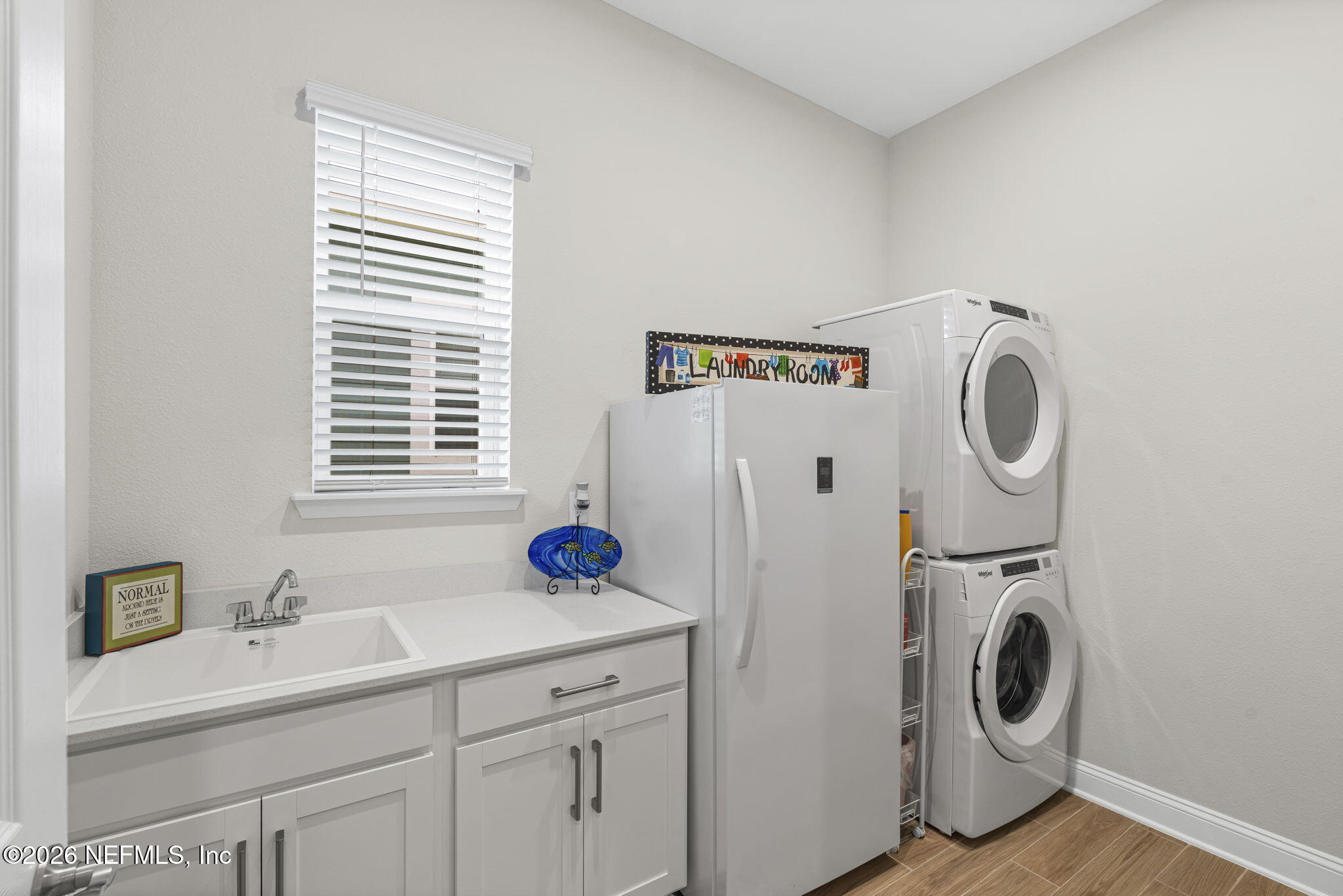 33 Pigeon Cove St. Johns, FL 32259 - Photo 15 of 37 a utility room with sink dryer and washer