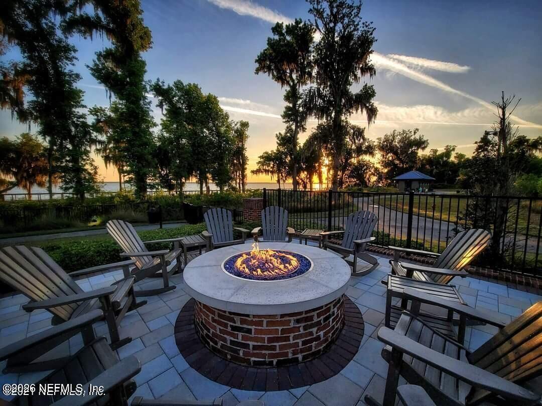 33 Pigeon Cove St. Johns, FL 32259 - Photo 34 of 37 a view of a roof deck with couches table and chairs and potted plants
