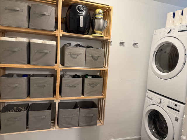 433 East 200 South Payson, UT 84651 - Photo 21 of 21 Stacked washer and dryer unit, complemented by a multi-tiered wood-frame shelving system