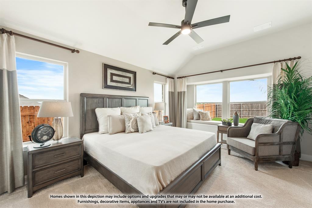 1108 Edgemire Lane Aubrey, TX 76227 - Photo 22 of 34 a bedroom with a bed a couch and a large window