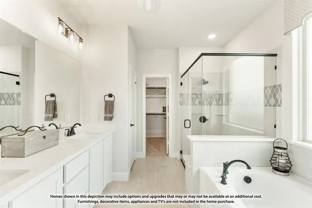 a bathroom with a tub sink and mirror