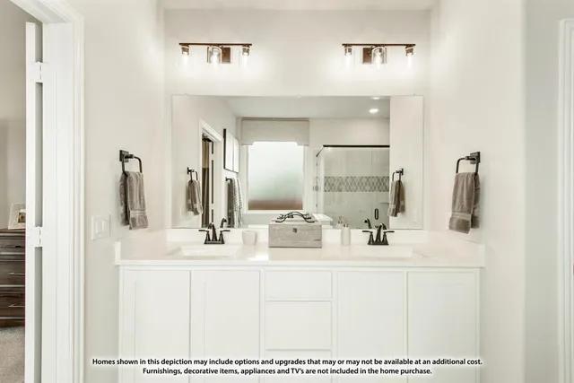 a bathroom with a sink vanity and mirror