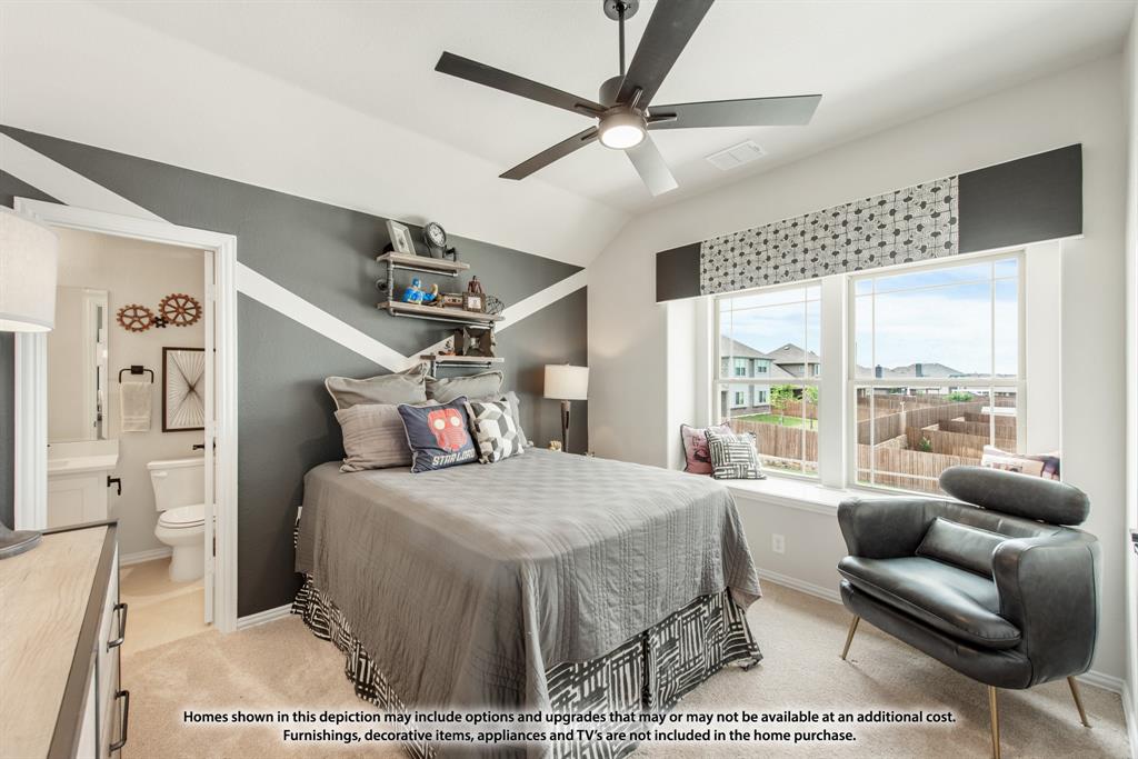 1108 Edgemire Lane Aubrey, TX 76227 - Photo 32 of 34 a bedroom with a bed a couch and a window